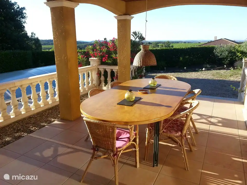 Nice outdoor living on the porch.
I see a boat on the Mediterranean?