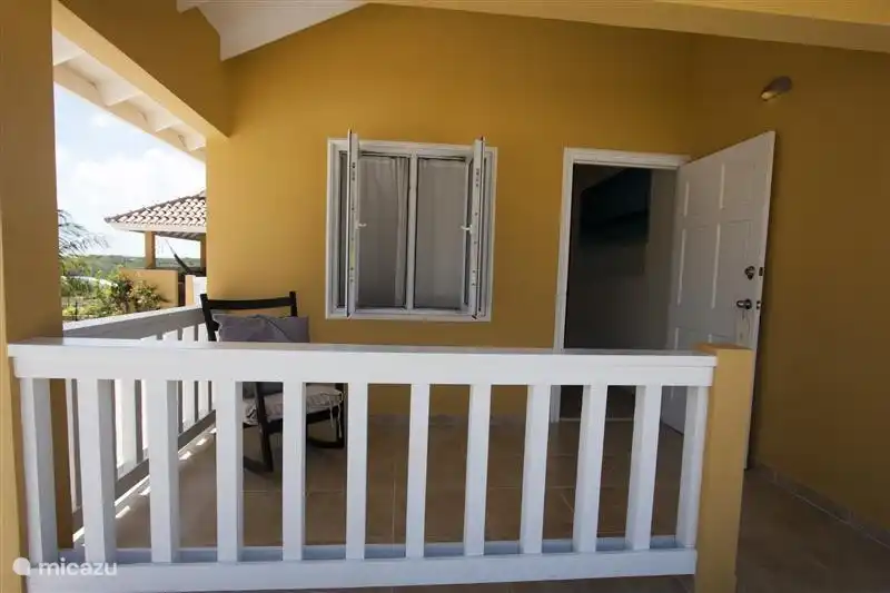 Front porch of the house with rocking chair