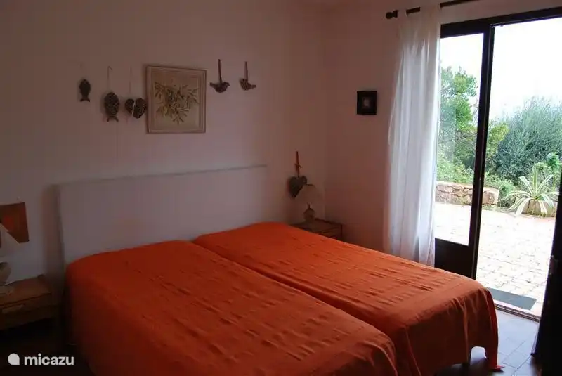 One of the bedrooms with direct access to the garden