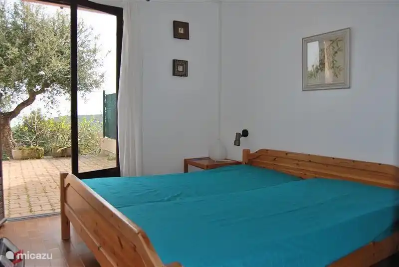 One of the bedrooms with direct access to the garden