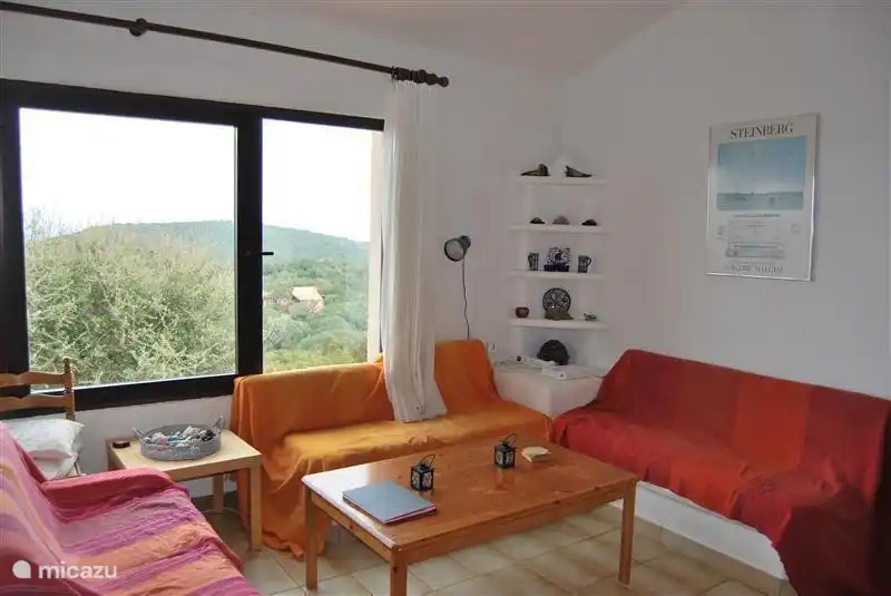 The living room overlooking the bay of La Chiappa