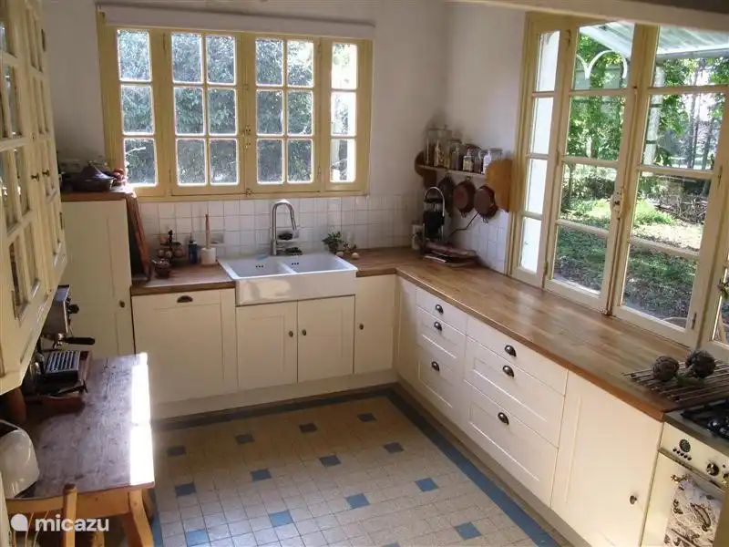 the kitchen, with its modern equipment and views onto the garden