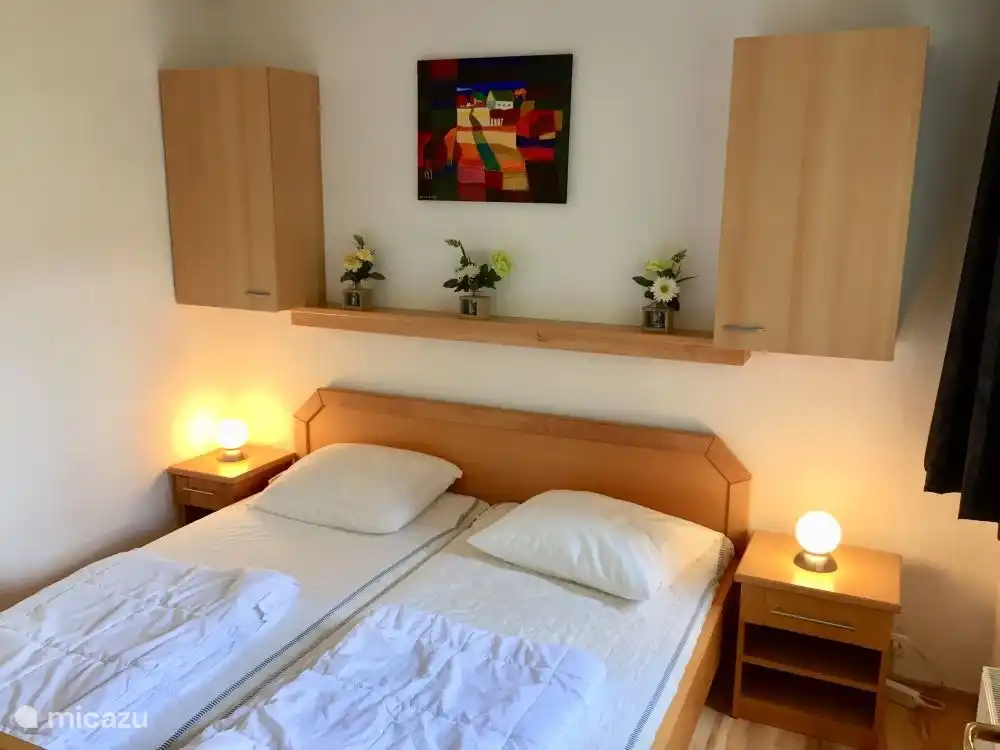 Lovely 2 person (parent) bedroom, with bedside tables and wall cabinets for clothes etc. (Bed linen is available)