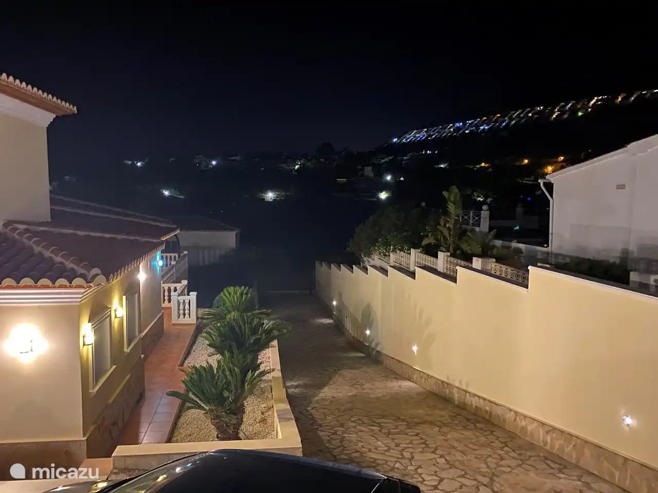 The driveway has lights, which makes parking in the garage easier