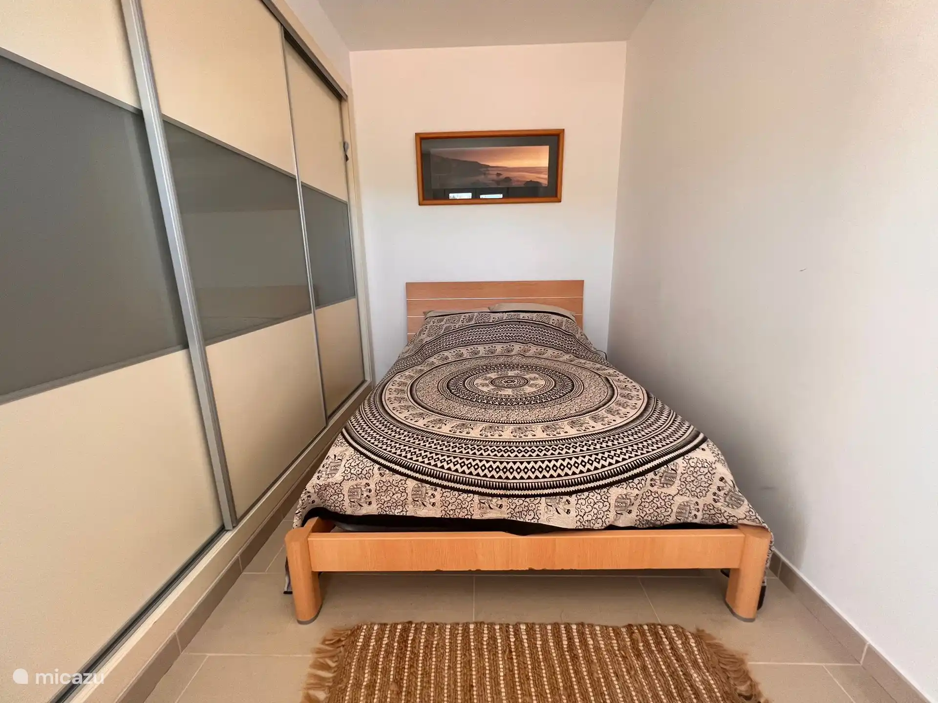 This is one of the bedrooms of the upper floor. 