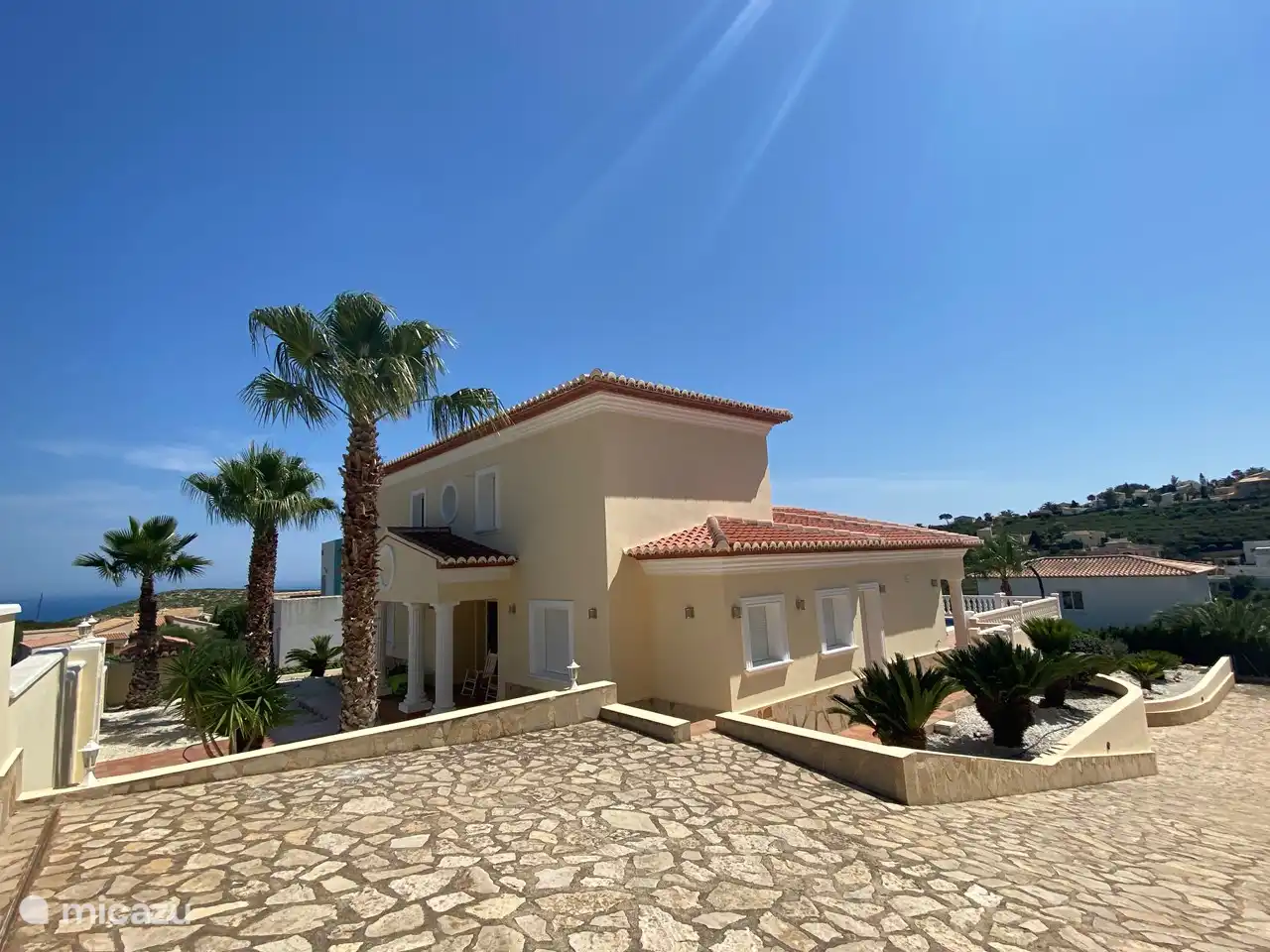 The driveway has space for several cars.