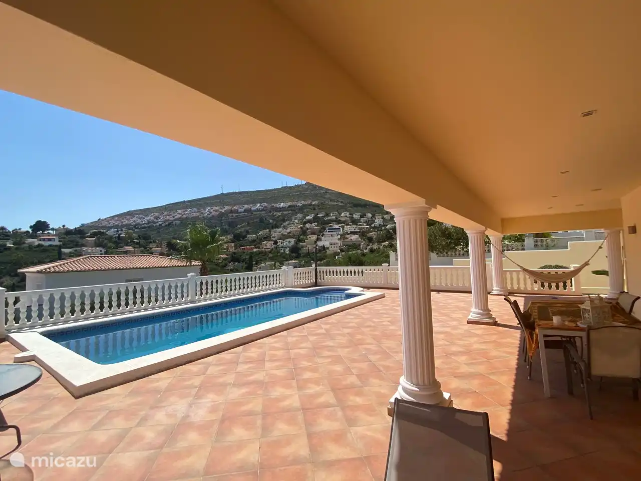 The outdoor terrace features a swimming pool, outdoor shower, sunbeds, parasol, hammock and BBQ. 