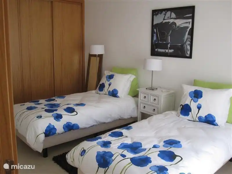 The bedroom on the ground floor, with 2 single beds that can be. Put together Again, a spacious wardrobe and terrace available with electric shutters.