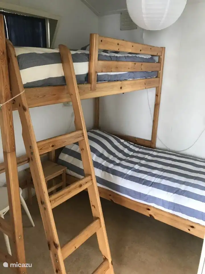 Bedroom with bunk bed in corner arrangement