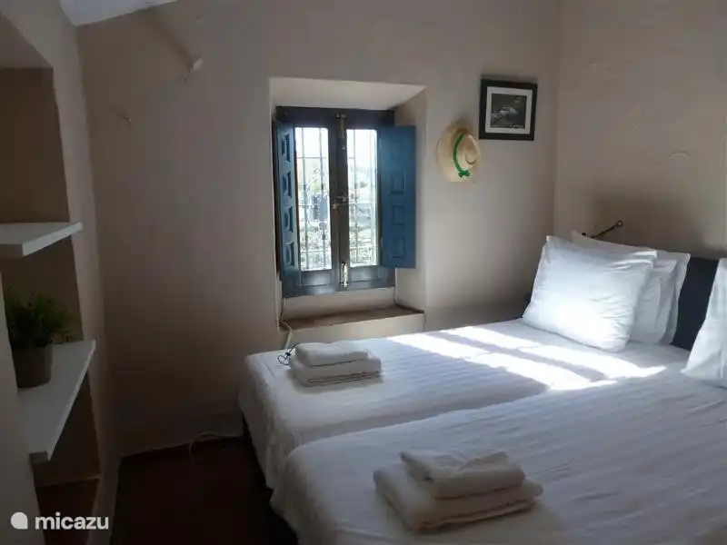 Bedroom 2 with 2 large beds and fitted wardrobe.