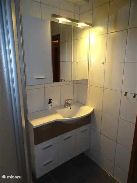 The bathroom has been completely refurbished. Vanity unit is equipped with an electrical outlet. There is a hairdryer available.
