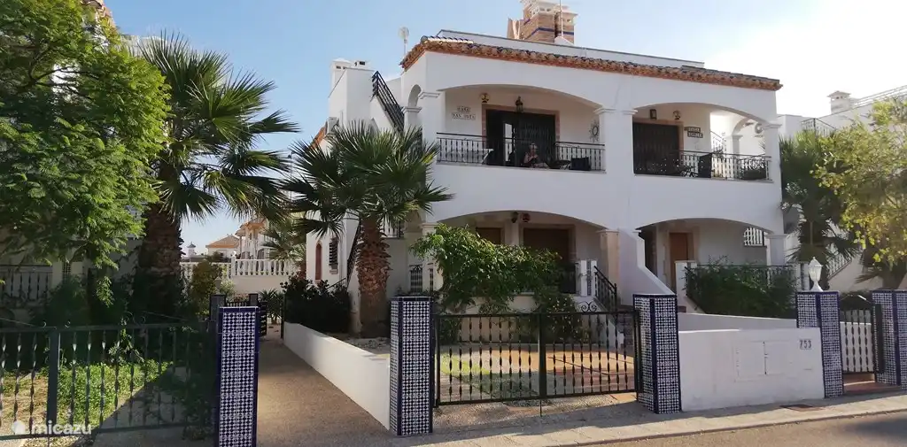 Front of apartment on the first floor. The apartment has its own entrance on the side. You can park in front of the door.