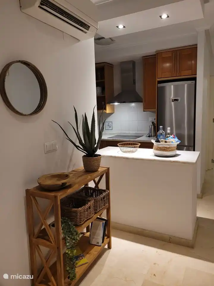 The open kitchen with all necessities such as fridge-freezer, dishwasher, oven and kettle. In addition to a regular coffee maker, there is also a Senseo.