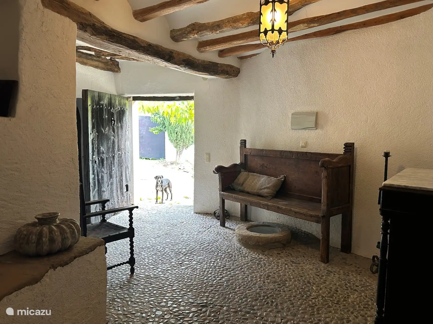 The entrance of Casa Milan and Ravi is waiting outside.