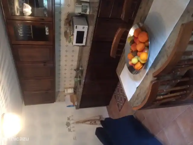 Kitchen / sitting area with dining table for 6 people. Dishwasher and microwave and champagne glasses for special occasions.