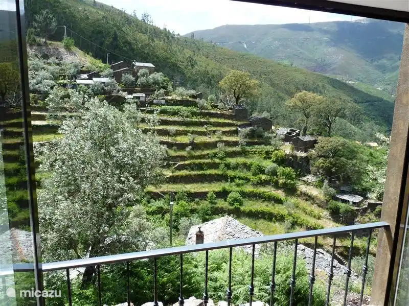 View from larger bedroom with windows that open.