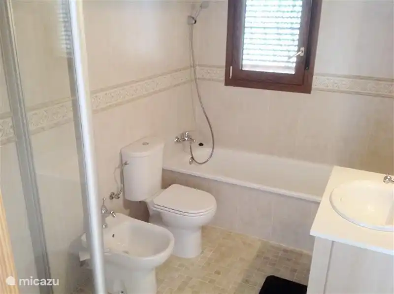 Look in the second bathroom with a shower and a bathtub on the left.