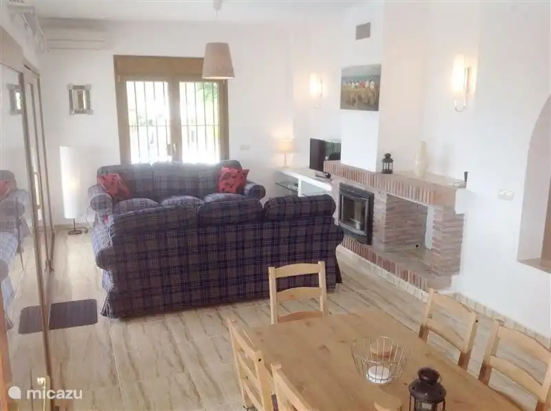 View from the kitchen towards the seating area. Large windows bring a lot of light into the Villa.