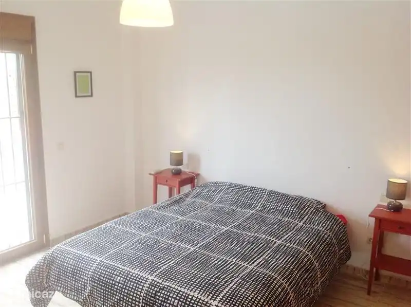 Here you will see the master bedroom (with en-suite bathroom). The French doors on the left give a view of the pool.