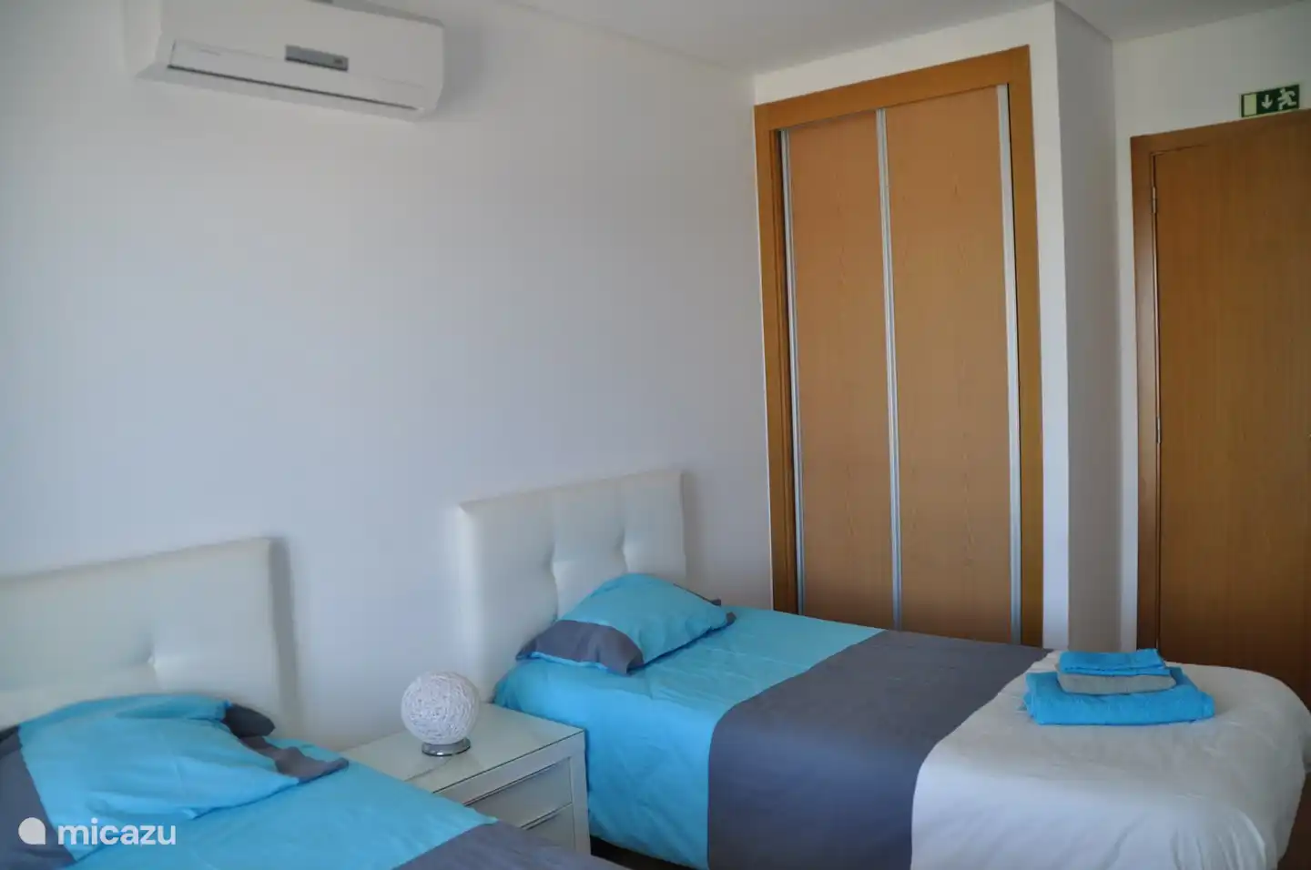 Room with 2 single beds and spacious closet.