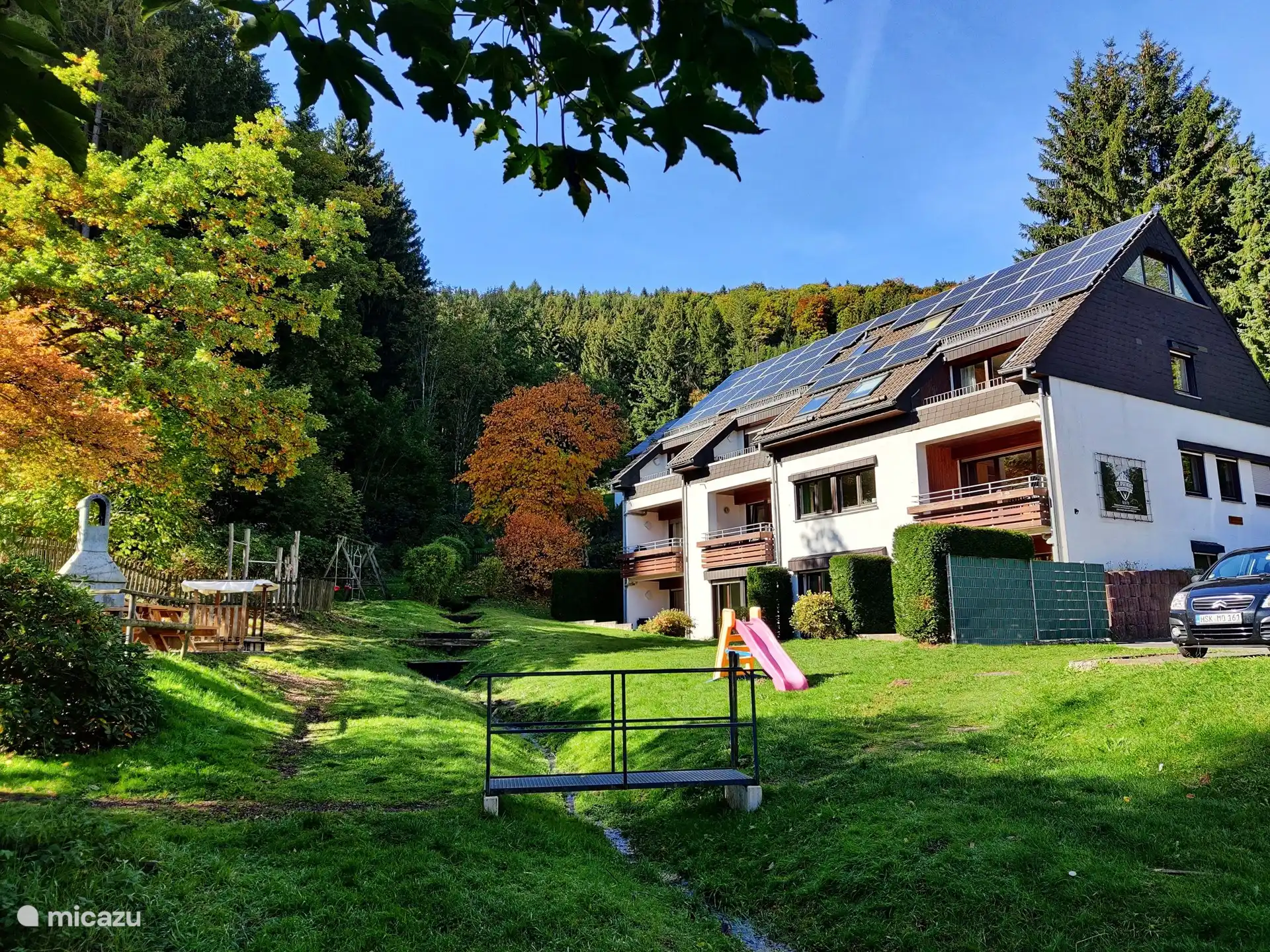 The apartment is located in this small-scale complex on the ground floor. There is a spacious sunny garden around the house and it is surrounded by forest.