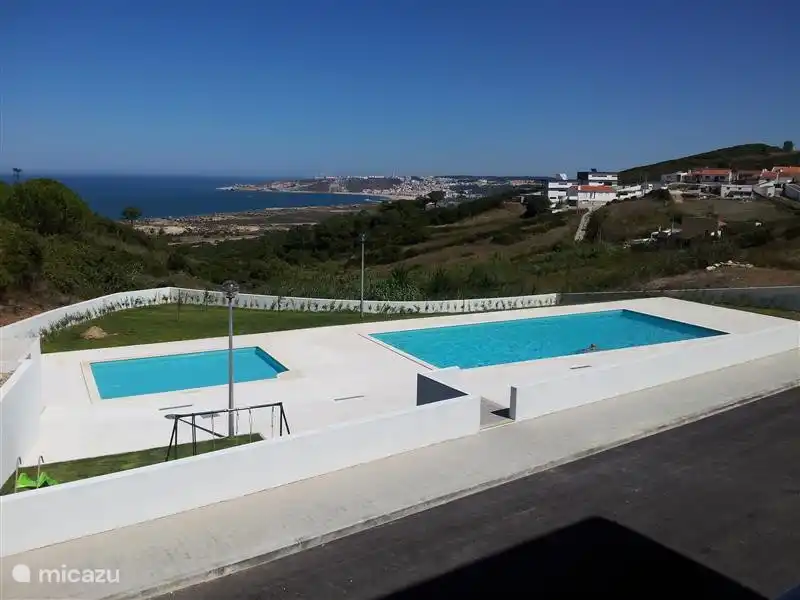 View from the villa on the two community pools, the nature and the ocean. Also view on town Nazar&#233;.