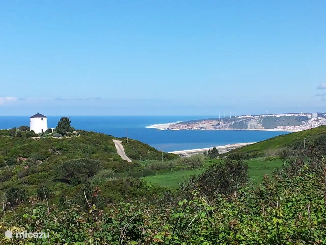 Surroundings of the villa, on the way to the typical Portuguese restaurant Tasca do Janeca a few minutes walk from the villa. The whole way you can enjoy a beautiful view; left over the interior, and right over the ocean and the nature reserve.