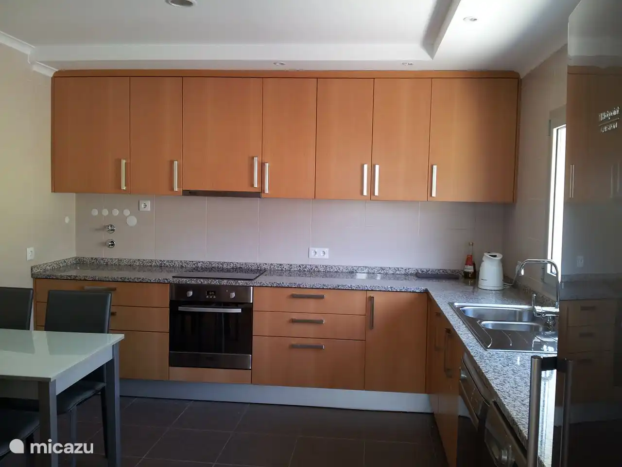 Fully equipped kitchen with: - kitchen table and 4 chairs - oven - ceramic hob - fridge - freezer - dishwasher - washing machine,...