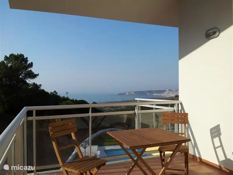 One of the four spacious terraces with garden furniture and stunning sea views.
