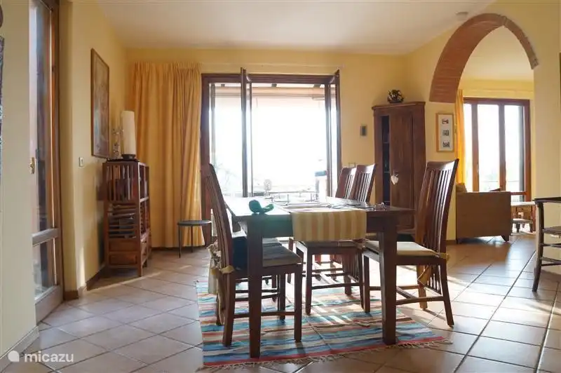 You can see the two open doors which provide access to the terrace and swimming pool.