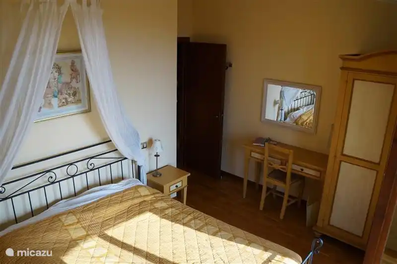 Main bedroom which has a balcony.