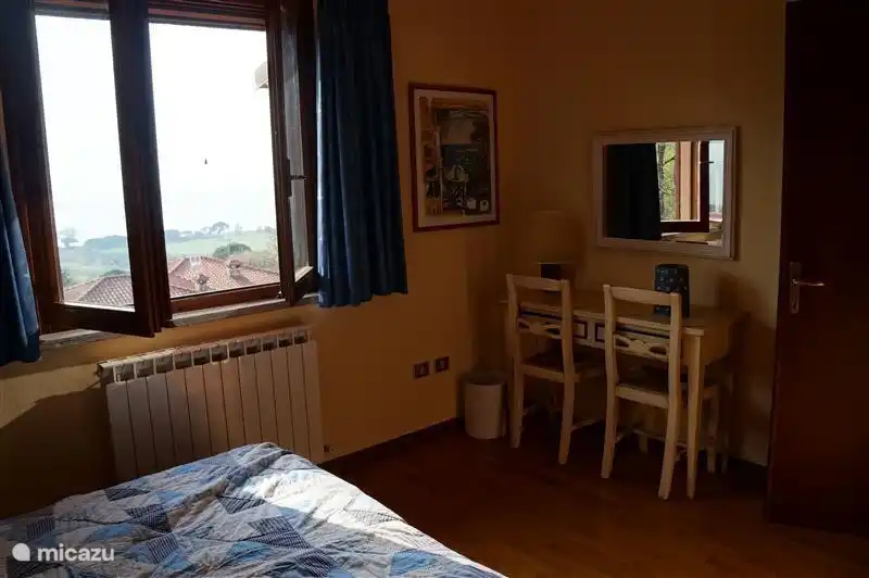 The &#39;blue&#39; bedroom. From the window you have a view over lago Trasimeno.