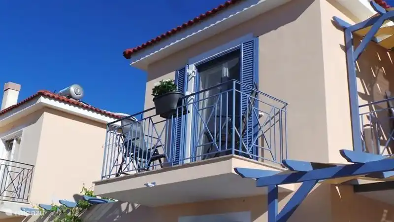 Balcony from bedroom with sea behind