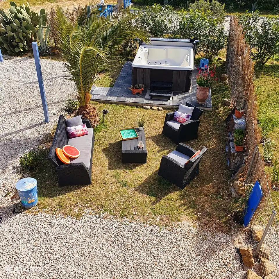 Lounge area with jacuzzi and solar shower