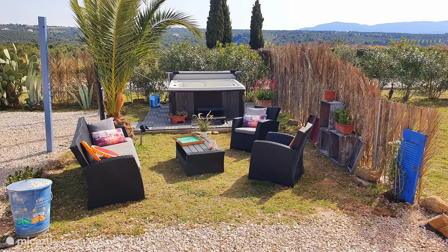 Lounge area with jacuzzi and solar shower