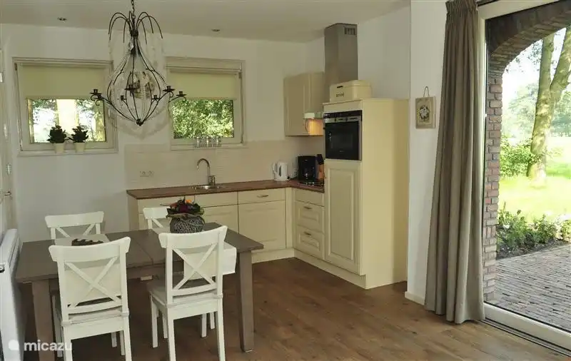 The kitchen is fully equipped. With patio doors to the terrace.