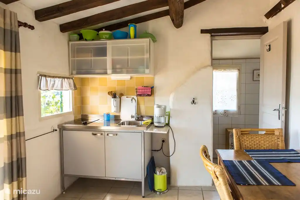 Ga je door de porte- fenêtre naar binnen