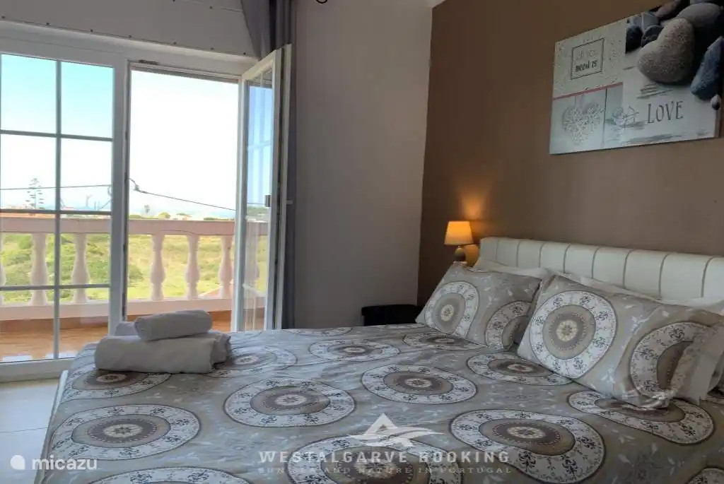 Slaapkamer met balkon