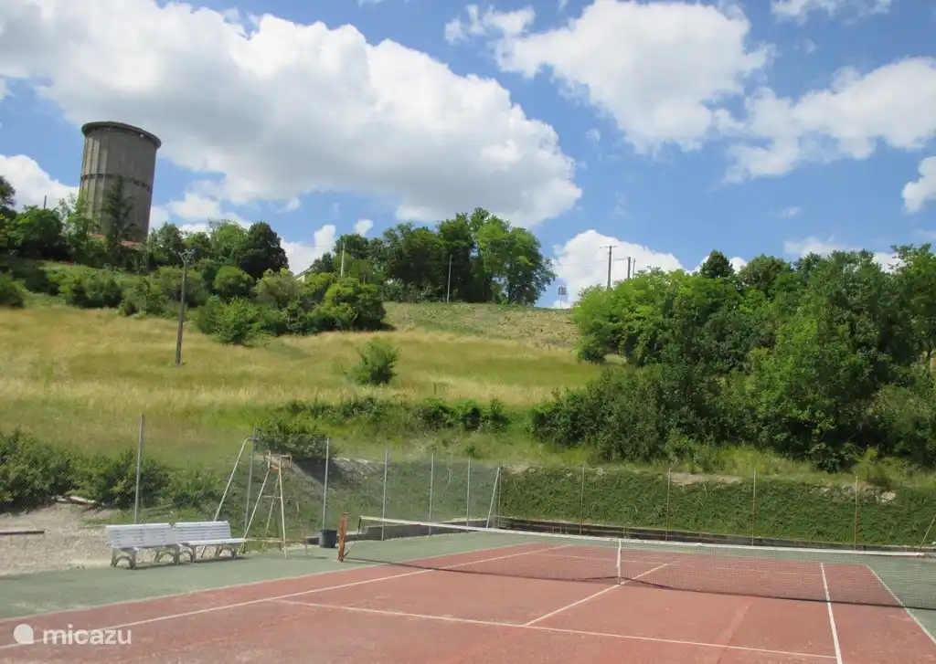 Tennis court beside the house