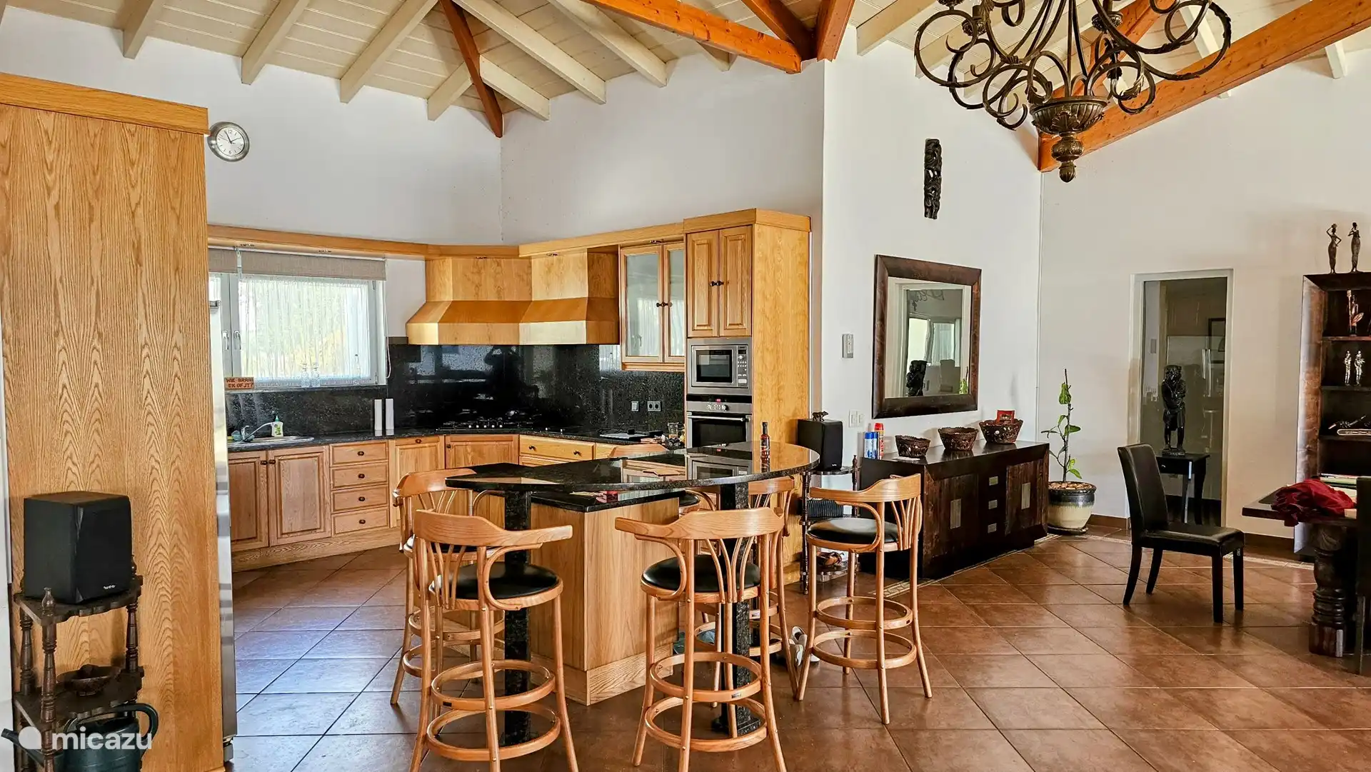 The kitchen with a cozy bar.
