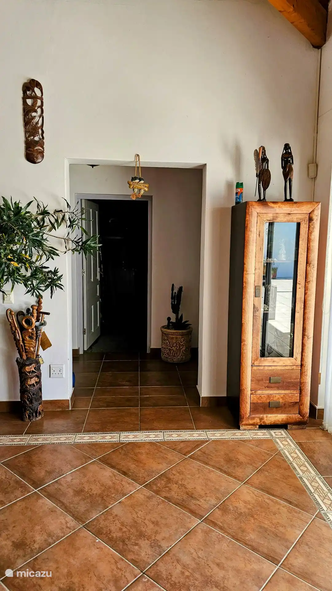 The entrance to the right part of the bedrooms and garage. The washing machine and dryer are also located in the garage.