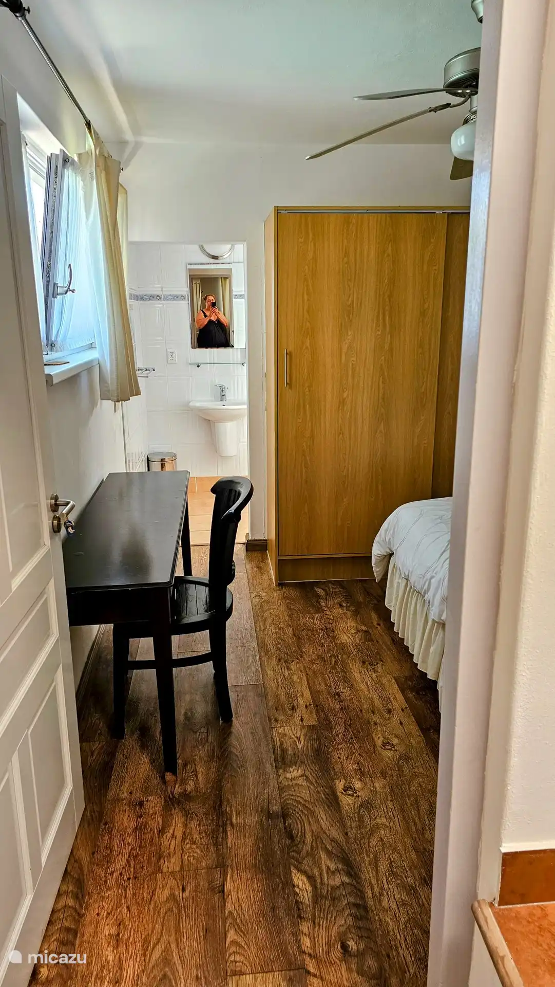 The bedroom overlooking the pool. All bedrooms have windows that can be opened.