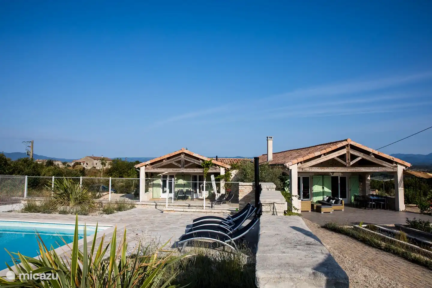 Both houses for 12 people seen from private pool