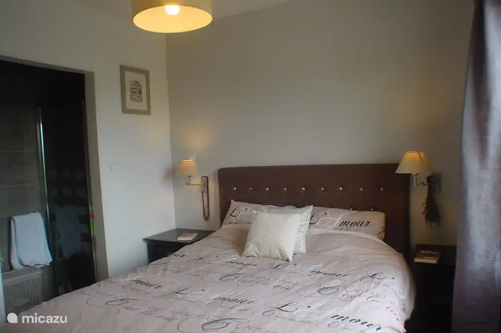 Bedroom 3 with its own en-suite walk-in shower and sink.