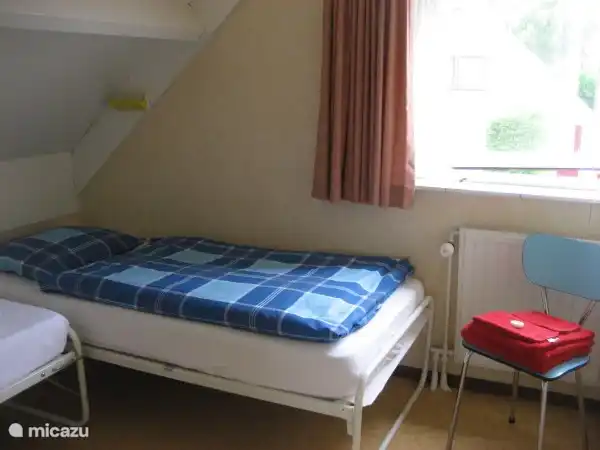 Second bedroom with two single beds.