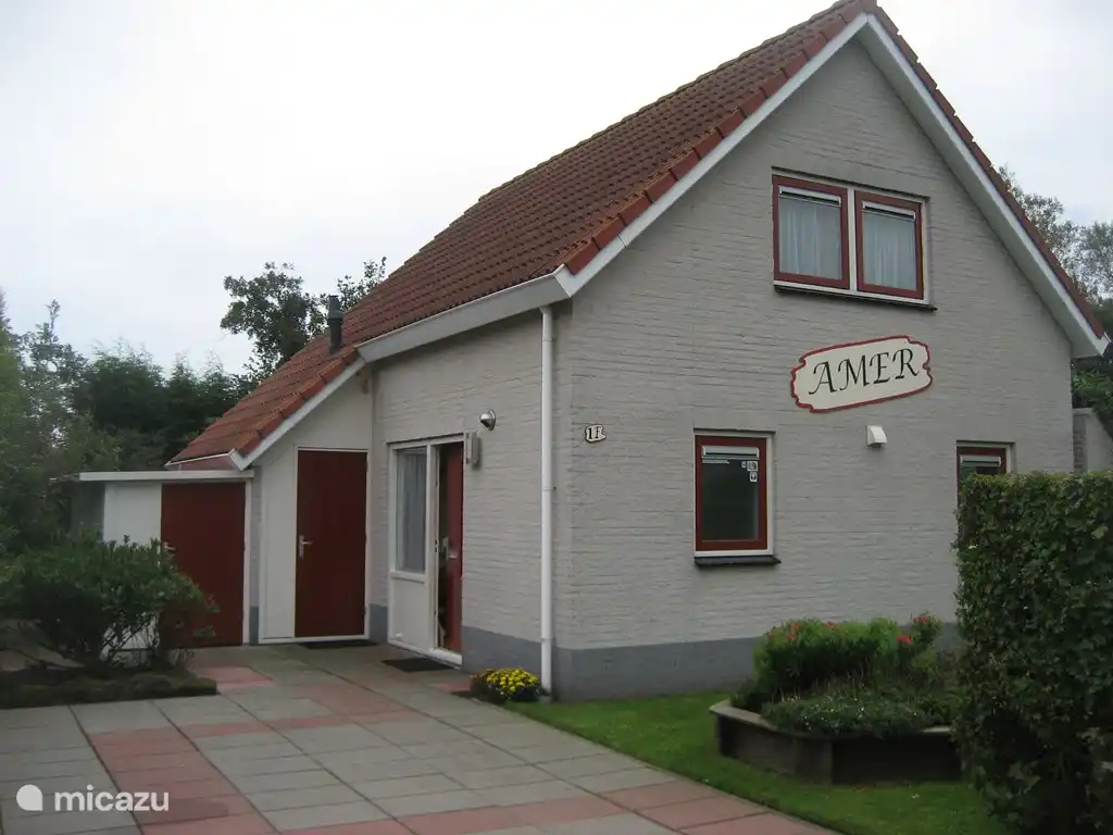 Front of Amer holiday home with private driveway for two cars.