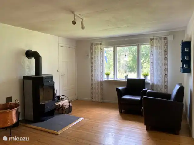 vakantiehuis huren in Zweden, Småland, Vägla (tussen Markaryd en Hallaryd) – Ellefors woonkamer en haard