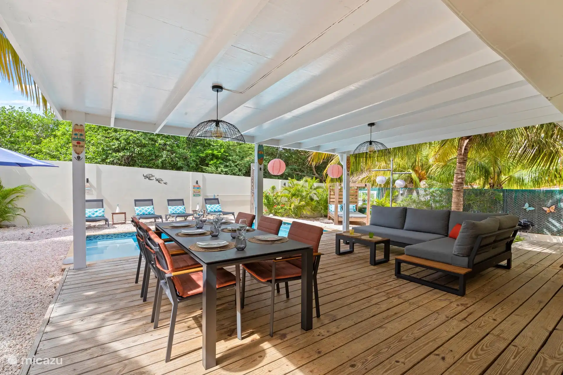 The pool deck has 1 lounge sofa and a dining area, both for 6 people