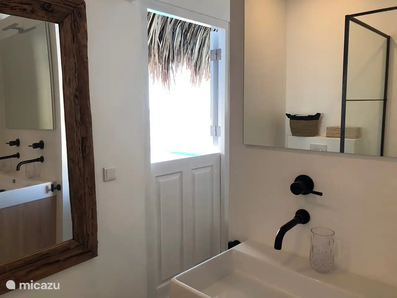 Bathroom 2nd bedroom, with 2 sinks, shower and toilet.