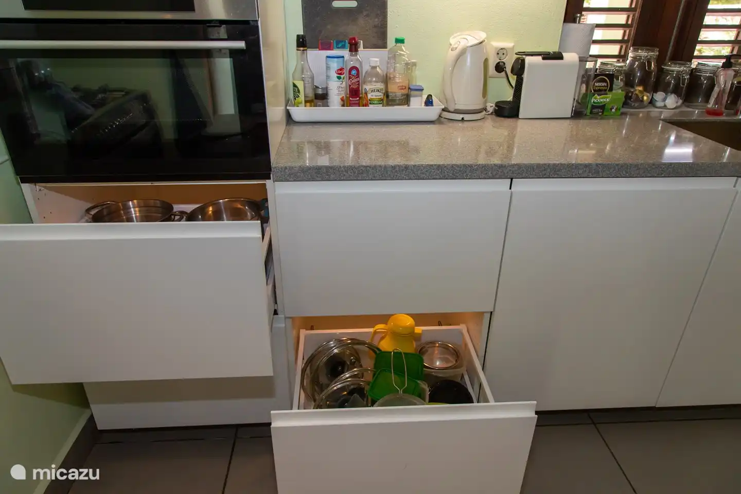 The drawers of the kitchen are lit. This way you can easily find the things you need to prepare your own meal.